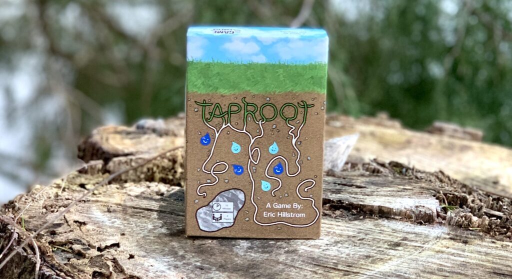 The game Taproot picture in a natural setting on a stump.